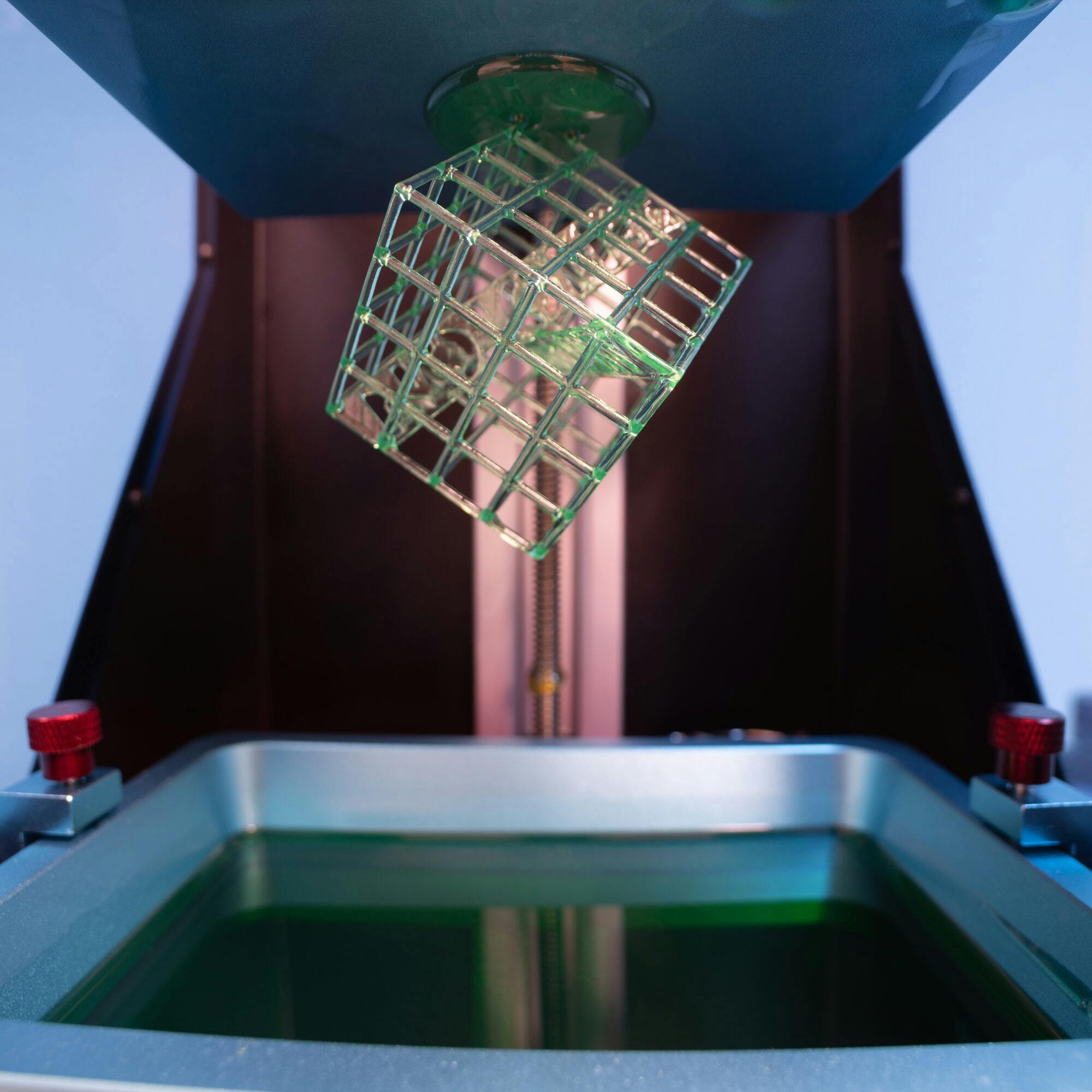 DLP and SLA 3D-printing are both Vat photopolymerization processes where a photopolymer bed is exposed to UV light to shape a 3D-printed object.